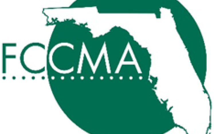 FCCMA logo State of Florida shape on green circle