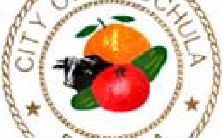 city of wauchula logo, cow, orange, tomato 